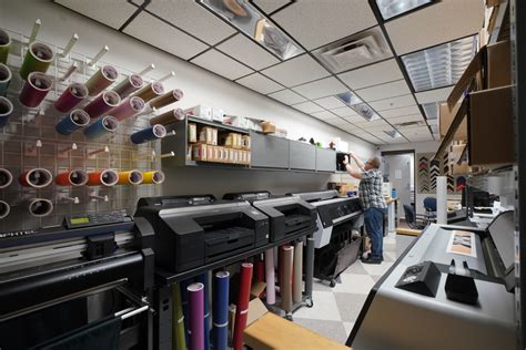 Print shop grows into new location .